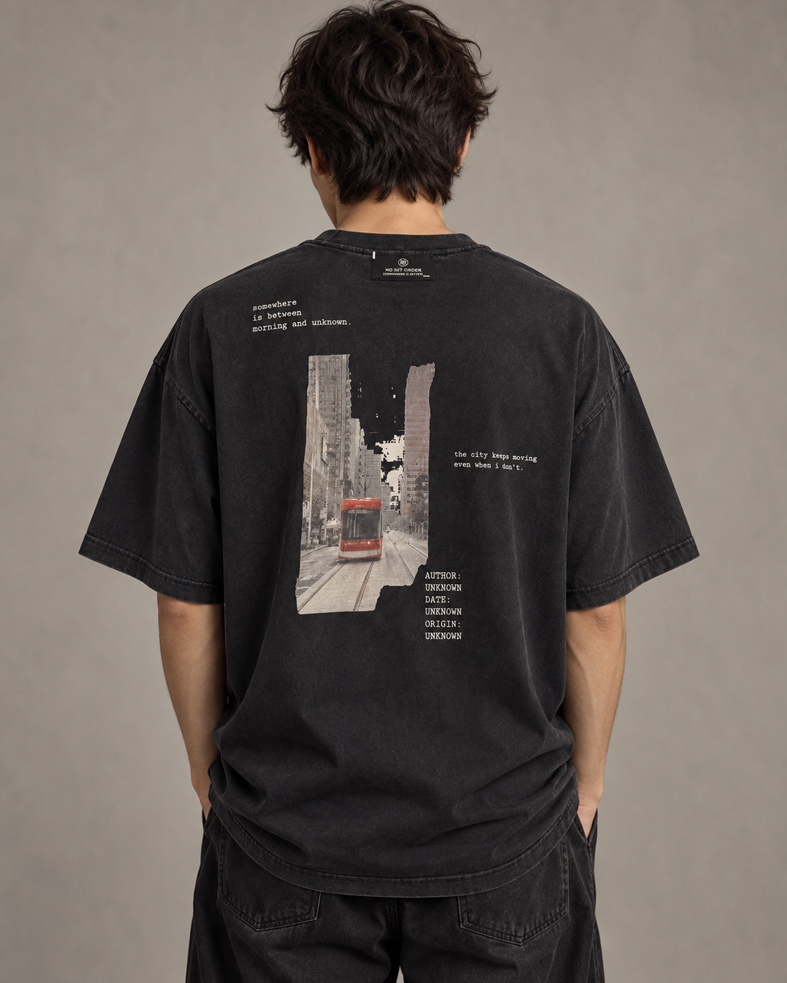 No Set Order Edition 001 oversized T-shirt worn from the back, showing the tram print and external neck label